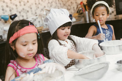 Girls preparing food at home