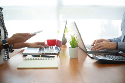 Man using laptop on table