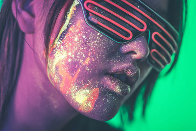 Close-up of young woman with face paint