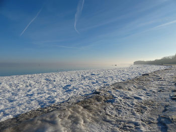 Scenic view of sea against sky during winter