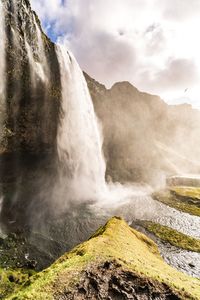 Scenic view of seljalandsfoss waterfall against sky