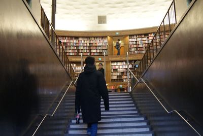 Rear view of man on staircase