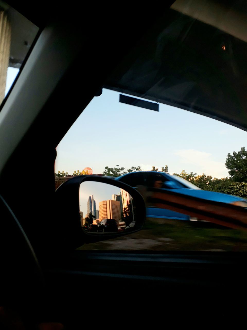 CLOSE-UP OF BRIDGE AGAINST SKY SEEN FROM CAR