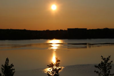 Scenic view of sunset over river