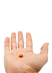 Close-up of hand against white background