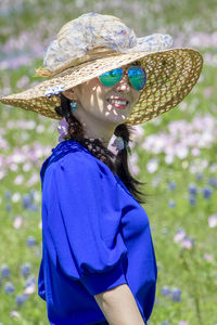 Midsection of woman wearing hat