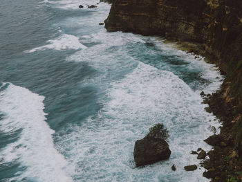 High angle view of rocks in sea