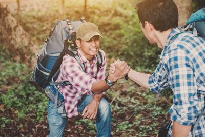 Friends standing on land