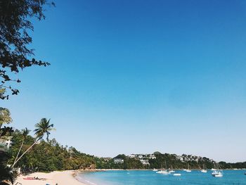 Scenic view of sea against clear blue sky