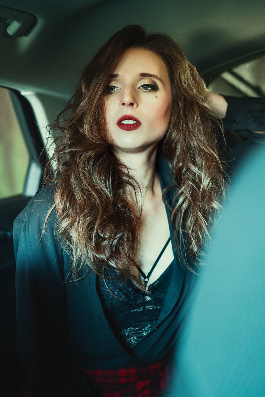 one person, motor vehicle, mode of transportation, car, vehicle interior, young women, beautiful woman, car interior, young adult, hair, front view, long hair, transportation, women, beauty, portrait, hairstyle, adult, indoors, mouth open