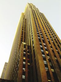 Low angle view of skyscrapers against clear sky