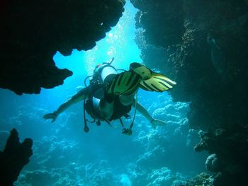 Full length of person scuba diving in red sea