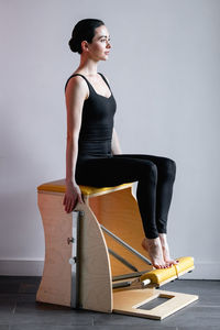 Young woman exercising at gym