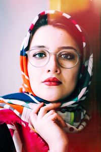 Close-up portrait of young woman wearing scarf