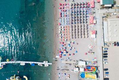 High angle view of people on street by sea