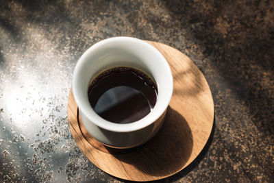 High angle view of coffee cup on table