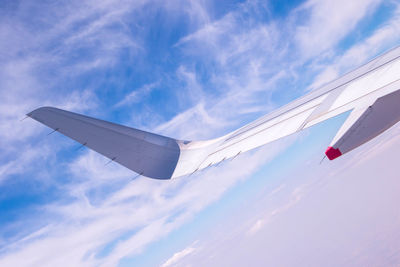 Low angle view of airplane flying in sky