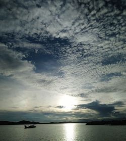 Scenic view of sea against dramatic sky