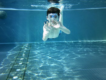 Child swimming in pool