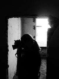 Woman photographing through camera