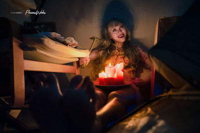 Young woman looking away at home