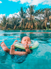 Portrait of shirtless man in swimming pool