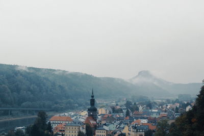 Buildings in city against sky