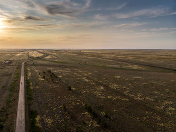 Scenic view of landscape against sky during sunset