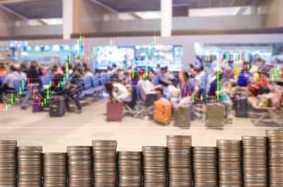 Double exposure of stacked coins and chart