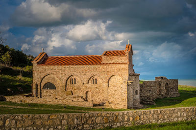 Low angle view of historic building against sky