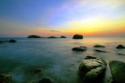 Scenic view of sea at sunset