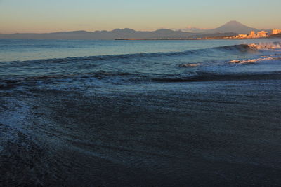 Scenic view of sea against sky at sunset