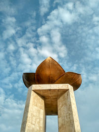 Low angle view of old tower against sky