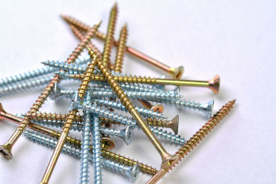 High angle view of chain on table against white background
