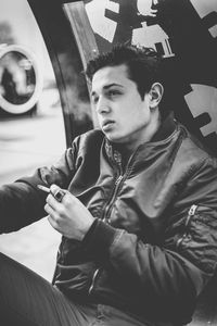 Close-up of young man sitting in car