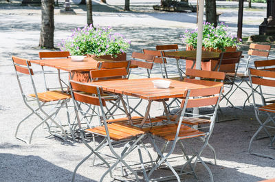 Empty chairs and tables at an outdoor restaurant