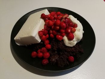 High angle view of strawberries in plate