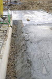 High angle view of frozen water on land