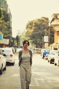 Portrait of woman standing on street