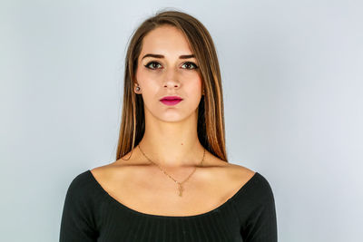 Portrait of a beautiful young woman over white background