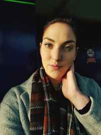 Portrait of young woman at home