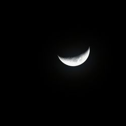 Low angle view of moon against clear sky at night