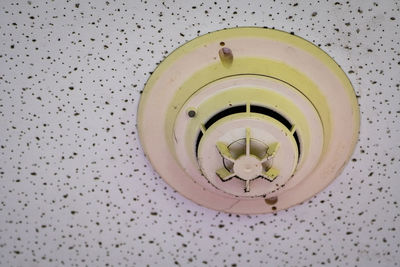 Directly below shot of electric lamp hanging on ceiling