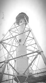 Low angle view of man working against sky