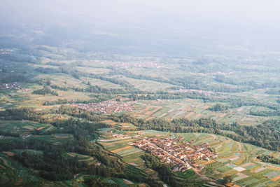 Scenery of remote villages surrounded with green terrace agricultural farm field crop
