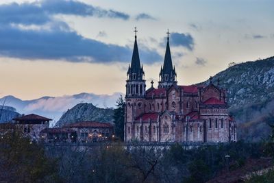 Church against sky at sunset