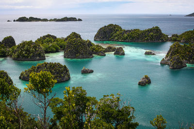 Scenic view of sea against sky at piaynemo geosite raja ampat