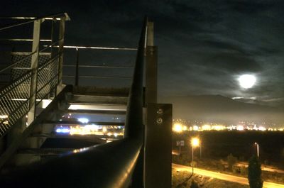 Low angle view of illuminated bridge at night