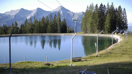 Scenic view of lake and mountains against sky