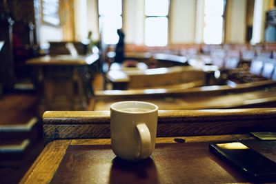 Close-up of coffee cup on table